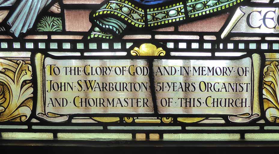 Dedication in a lower panel of the window